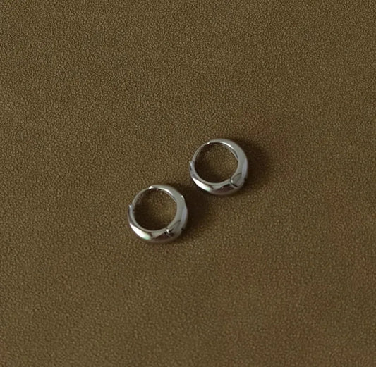 Aretes color acero bañado en oro